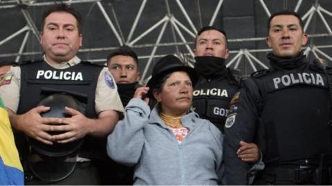 Police and demonstrators in Ecuador