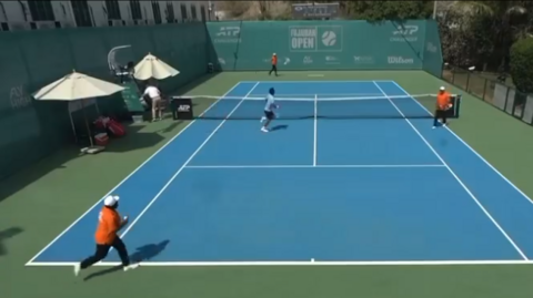 Players and officials run off court at the ATP Challenger event in Fujairah 