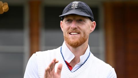 Ben Stokes smiles while clapping