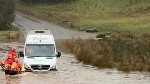 A bus stuck in water