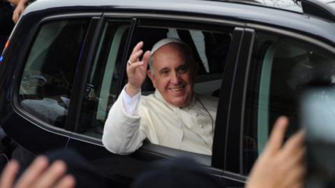 Pope Francis in a car