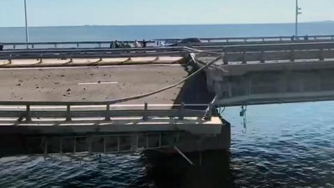 A view shows the section of a road split and sloping to one side following an alleged attack on the Crimea Bridge, that connects the Russian mainland with the Crimean peninsula across the Kerch Strait, in this still image taken from video released on 17 July 2023