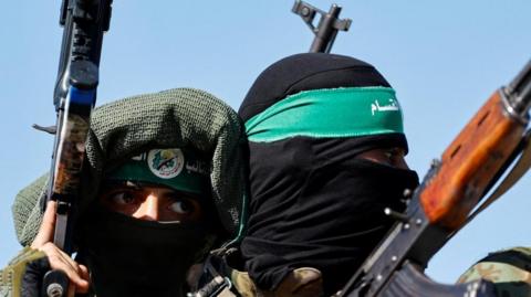Fighters from the armed wing of Hamas at military parade