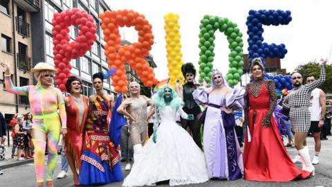 Pride balloons and drag queens