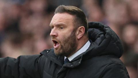 Bolton boss Ian Evatt stood on the touchline during match at Derby
