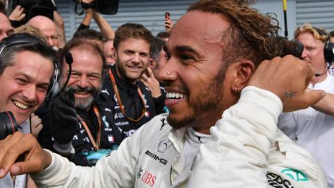 Lewis Hamilton celebrates winning the Italian GP