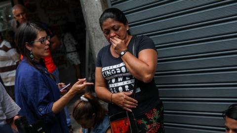 Relatives of victims of the stampede in the El Paraiso club in front of the police headquarters in Caracas, Venezuela, 16 June 2018