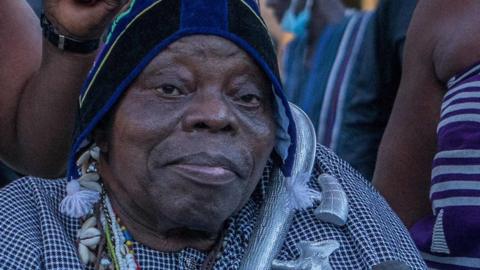 Dah Sagbadjou Glele (C), is seen during a ceremony where artefacts, some considered sacred in Benin, arrived at the presidential palace in Cotonou on November 10, 2021