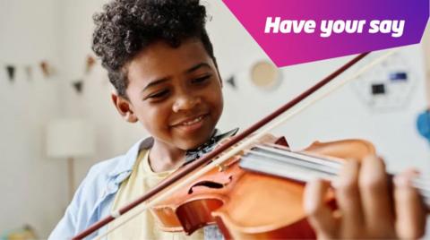 Boy playing violin.
