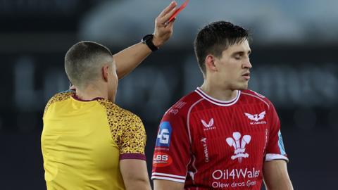 Tomas Lezana is shown a red card by referee Craig Evans