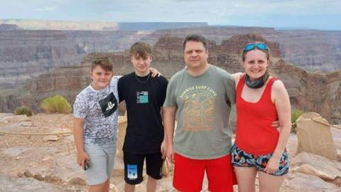 Gareth Heslop with his partner Sarah and their children