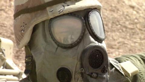 Soldier wearing gas mask