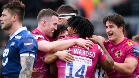 Exeter Chiefs players celebrate a try against Sale Sharks in their Premiership Rugby Cup semi-final