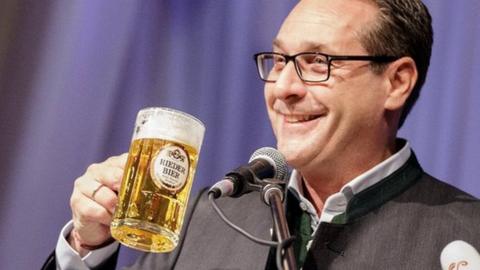 Heinz-Christian Strache, Austrian Vice-Chancellor and leader of the Austrian Freedom Party FPOe, holds a beer mug as he delivers a speech in Ried, Austria on 14 February 2018.