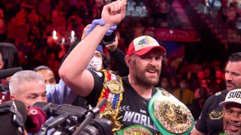 Tyson Fury celebrates with his WBC belt