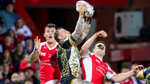 Louis Senior, Josh Charnley and Tom Opacic all vie for a high ball