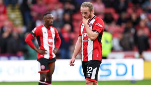 Tom Davies looking dejected post match for Sheffield United