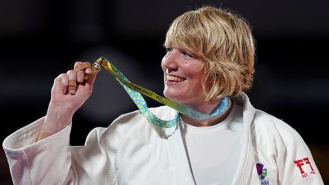 Scotland's Sarah Adlington celebrates winning gold in the judo's +78kg final