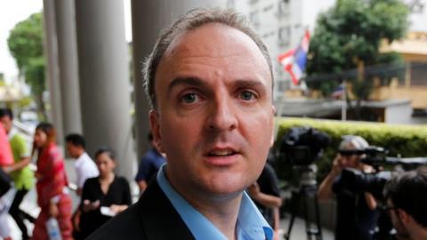 British rights activist Andy Hall leaves the Bangkok South Criminal Court