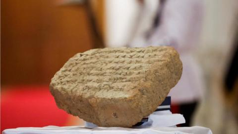 The 2,800-year-old stone tablet exhibited during a news conference in Baghdad, 18 June 2023.