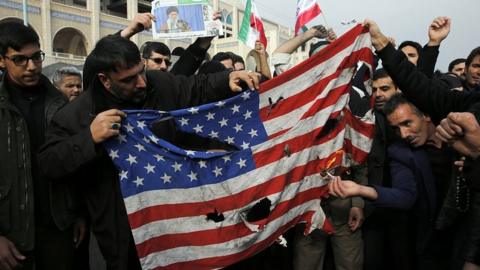 Iranians burn a US flag after Friday prayers in Tehran, Iran, 3 January 2020