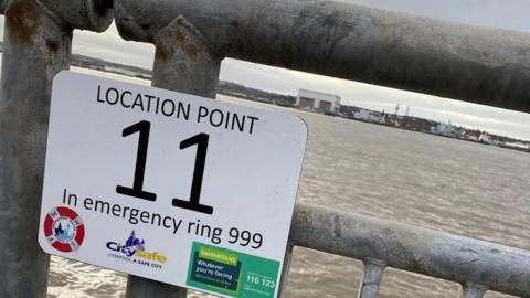 Location point sign on River Mersey