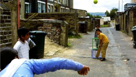 Boys playing cricket in Bradford in 2001