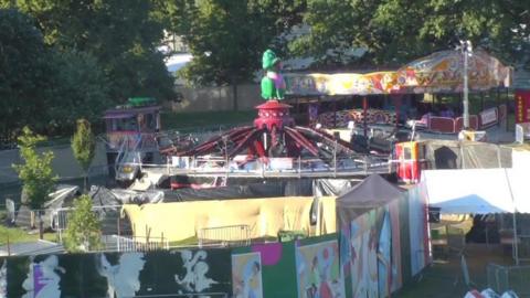 Tarpaulin around a fairground ride in Brockwell Park