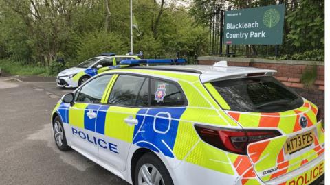 Police cars stationed outside Blackleach Country Park