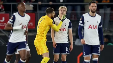 Tottenham players look disappointed after AZ Alkmaar's goal