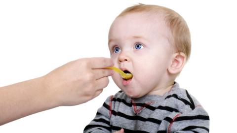 Feeding a baby with a spoon