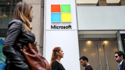 People walk past the Microsoft store on Fifth Avenue in New York City.