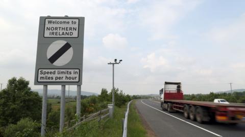 Traffic passes a border sign at Newry as you enter Northern Ireland from the Republic of Ireland