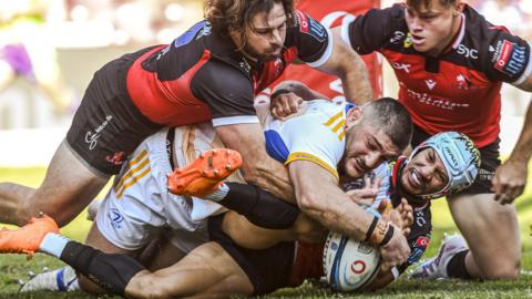 Leinster's Michael Milne scores a try against Lions