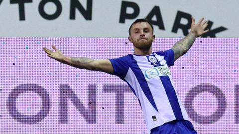 Dale Taylor celebrates scoring for Wigan against Huddersfield last season.