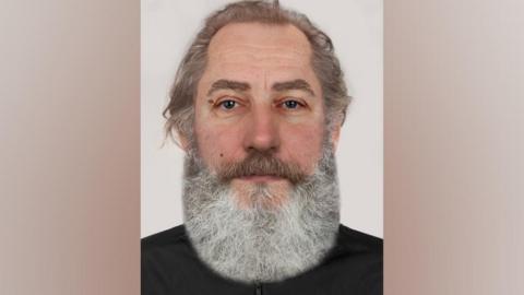 Man with grey hair and large beard