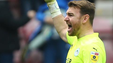 Wigan Athletic goalkeeper celebrates