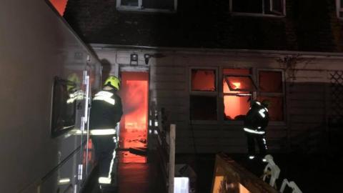 Crews tackle house fire