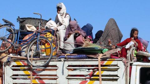 Afghans flee their villages after fighting intensified between Taliban militants and security forces, in Lashkar Gah, 12 October 2020.