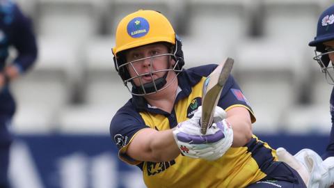 Abbey Freeborn plays a pull shot in Glamorgan's yellow jersey