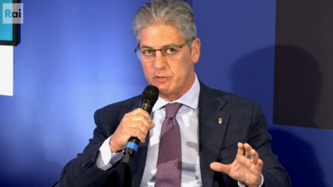 A man speaks into a microphone