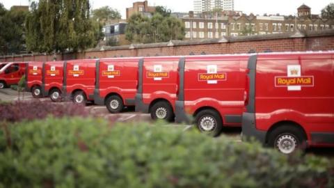 Royal Mail vans lined up at a depot