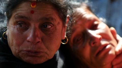 Grieving family members at a hospital in Kathmandu, Nepal (13 March 2018)