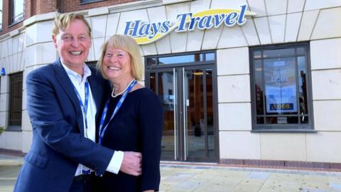 John and Irene Hays outside on of their shops