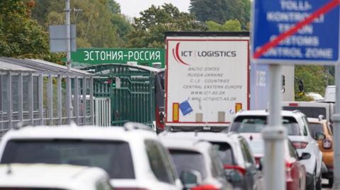 Vehicles wait at a border crossing with Russia, in Narva, Estonia, in September 2022