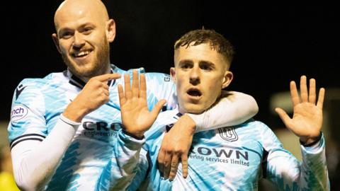 Dundee celebrate Luke McCowan's strikes