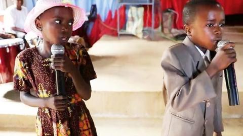 Ubang boy and girl singing