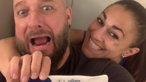 Corinne Laframboise and her partner celebrate after a positive pregnancy test