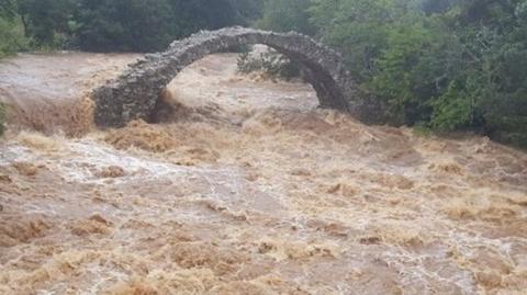 Footage posted on social media showed flooding at the 18th century packhorse bridge