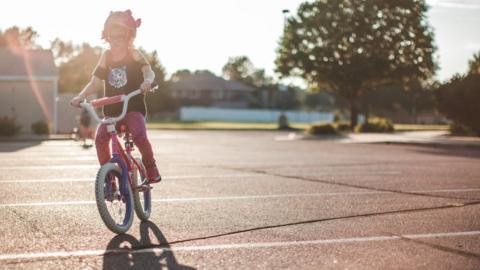 Girl on a bike generic image